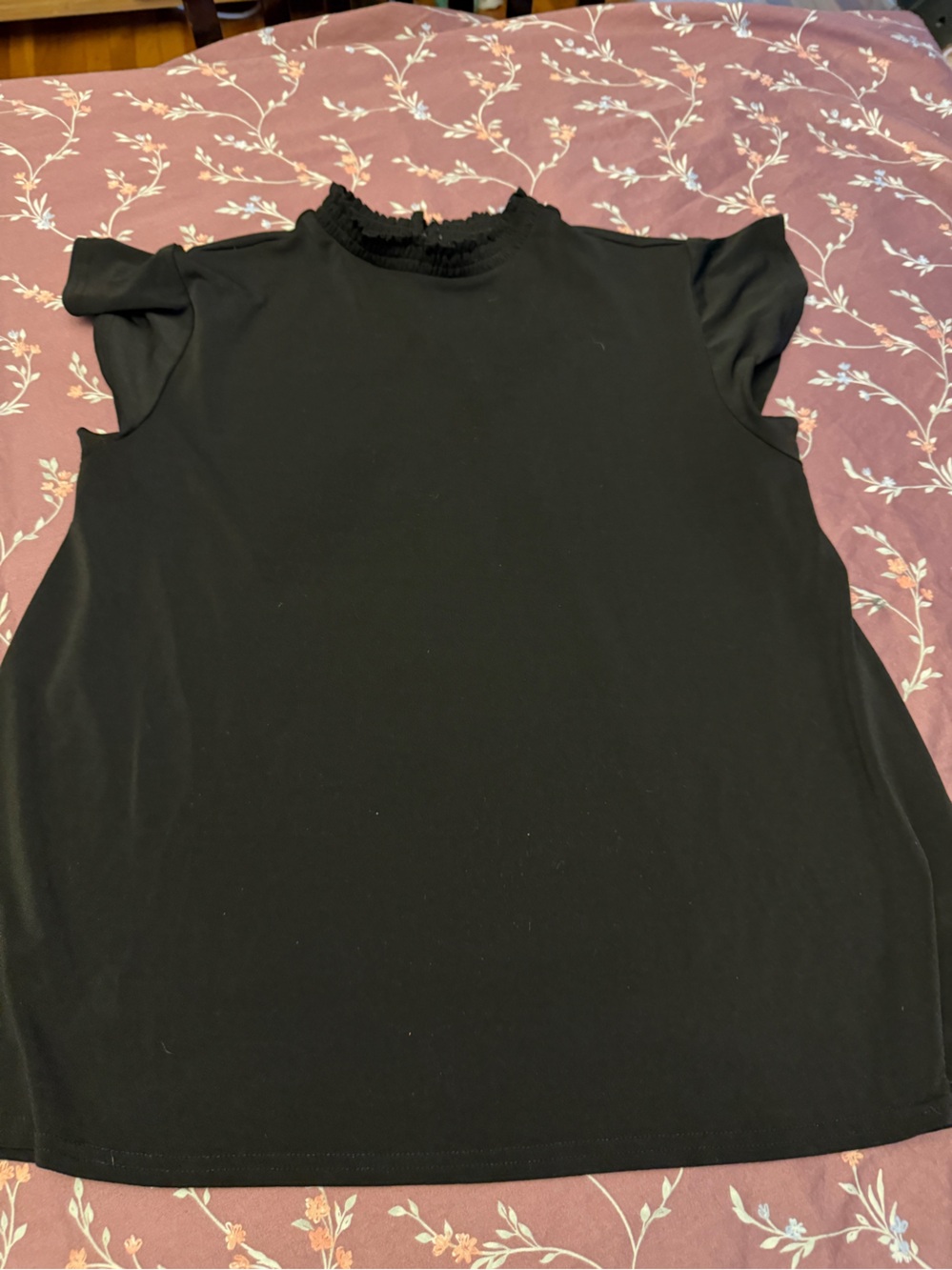 Black top with mock neck and flutter sleeve